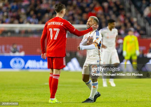 Brian Gutierrez of Chicago Fire embraces Luciano Acosta of FC Cincinnati during a game between FC Cincinnati and Chicago Fire FC at Soldier Field on...