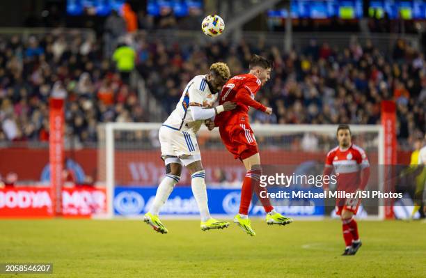 Brian Gutierrez of Chicago Fire battles for the ball with Aaron Boupendza of FC Cincinnati during a game between FC Cincinnati and Chicago Fire FC at...