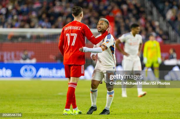 Brian Gutierrez of Chicago Fire embraces Luciano Acosta of FC Cincinnati during a game between FC Cincinnati and Chicago Fire FC at Soldier Field on...