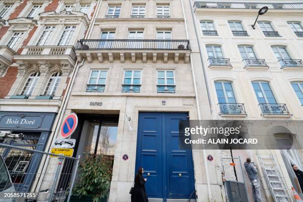 Photograph taken in Paris on March 7 shows the facade with a blue entrance door of the building housing the futuristic 260 m2 three-room apartment...