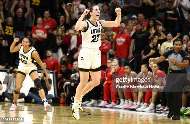 Caitlin Clark of the Iowa Hawkeyes celebrates after breaking Pete Maravich's all-time NCAA scoring record during the first half against the Ohio...