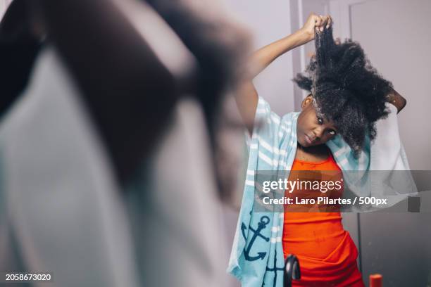 young woman cleaning her hair,corpus christi,texas,united states,usa - corpus christi stock pictures, royalty-free photos & images
