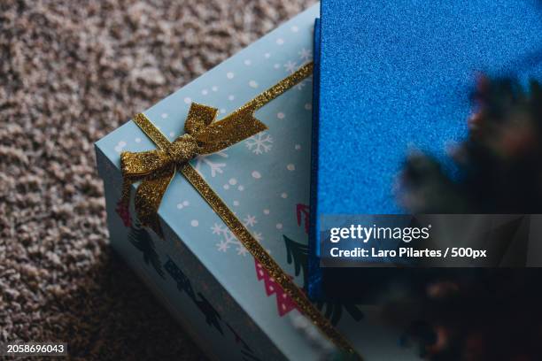 high angle view of christmas present with gift box on table,corpus christi,texas,united states,usa - corpus christi stock pictures, royalty-free photos & images