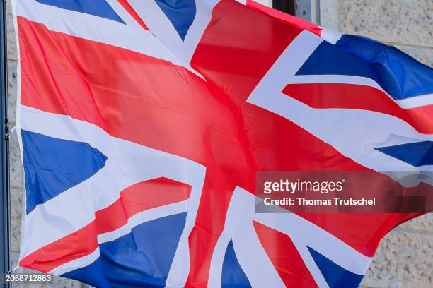 The flags of Great Britain wave in the wind on March 07, 2024 in Berlin, Germany.