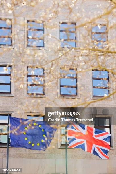 The flags of European Union and Great Britain wave in the wind on March 07, 2024 in Berlin, Germany.