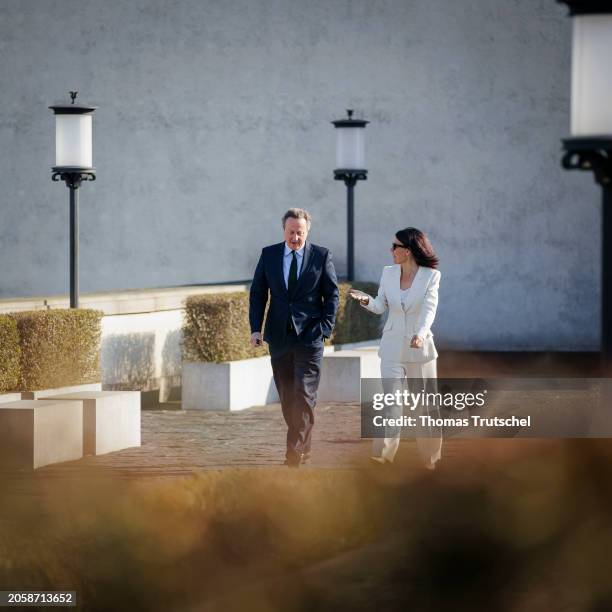 Annalena Baerbock, German Foreign Minister, and Britain's Foreign Secretary David Cameron chats during her meeting on March 07, 2024 in Berlin,...