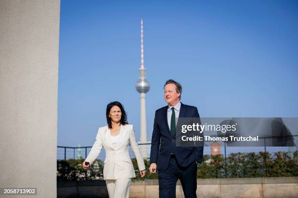 Annalena Baerbock, German Foreign Minister, and Britain's Foreign Secretary David Cameron chats during her meeting on March 07, 2024 in Berlin,...