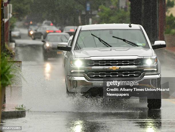 Truck splashes through a large puddle on Union St. During a rainfall on Monday, July 22, 2019 in Schenectady, N.Y.