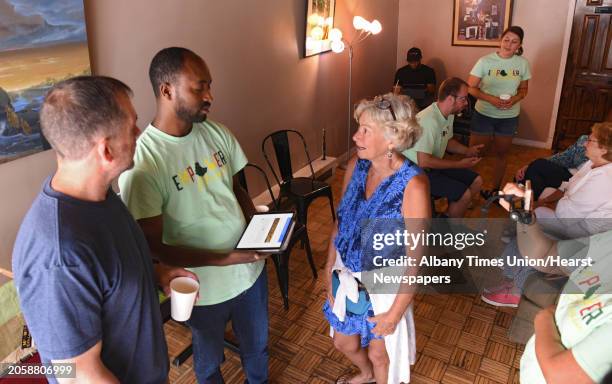 Susan Gallagher of Troy, right, talks to Belayneh Woldemariam of Ethiopia as Empower Ethiopian hosted a conversation and cultural exchange at Happy...