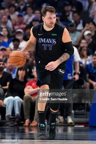 Luka Doncic of the Dallas Mavericks brings the ball down court during the second half against the Philadelphia 76ers at American Airlines Center on...