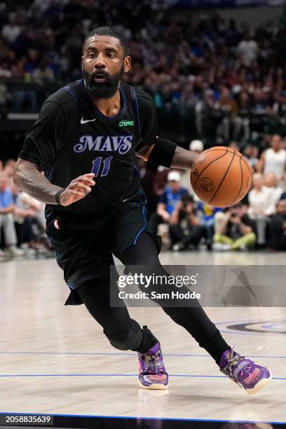 Kyrie Irving of the Dallas Mavericks controls the ball during the second half against the Philadelphia 76ers at American Airlines Center on March 03,...