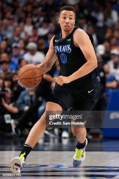 Dante Exum of the Dallas Mavericks brings the ball down court during the second half against the Philadelphia 76ers at American Airlines Center on...