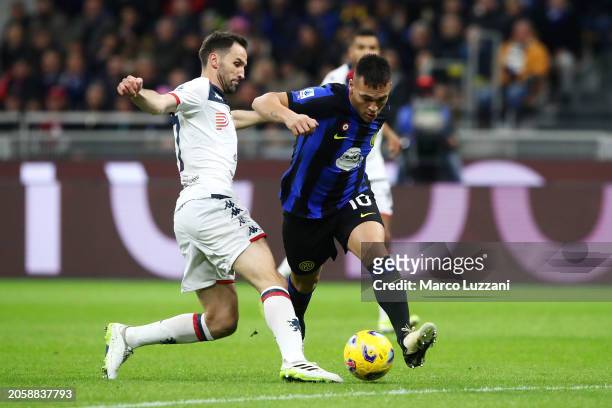 Lautaro Martinez of FC Internazionale is challenged by Milan Badelj of Genoa CFC during the Serie A TIM match between FC Internazionale and Genoa CFC...