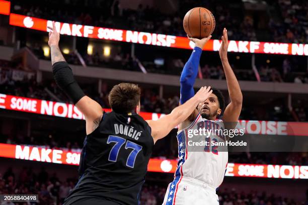 Tobias Harris of the Philadelphia 76ers is defended by Luka Doncic of the Dallas Mavericks during the first half at American Airlines Center on March...