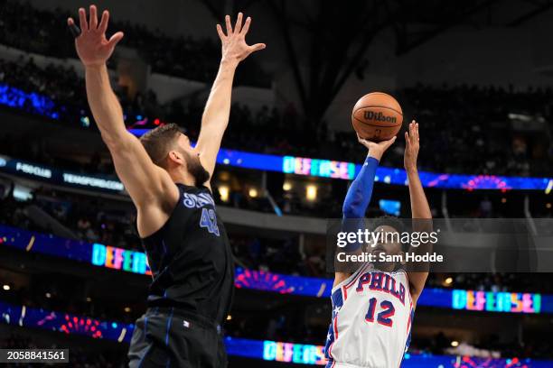 Tobias Harris of the Philadelphia 76ers is defended by Maxi Kleber of the Dallas Mavericks during the first half at American Airlines Center on March...