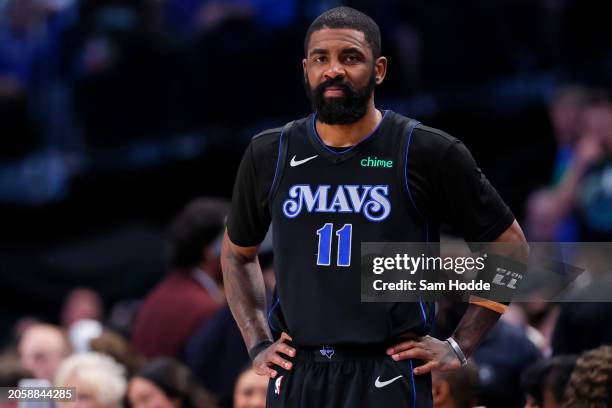 Kyrie Irving of the Dallas Mavericks looks on during the first half against the Philadelphia 76ers at American Airlines Center on March 03, 2024 in...