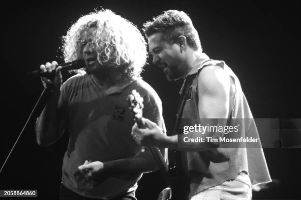 Sammy Hagar and Eddie Van Halen of Van Halen perform at Shoreline Amphitheatre on October 14, 1995 in Mountain View, California.