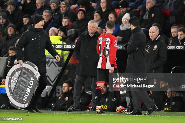 Oliver Norwood of Sheffield United is substituted and replaced Ben Osborn in the first half during the Premier League match between Sheffield United...