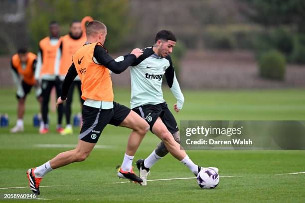 Enzo Fernandez and Alfie Gilchrist of Chelsea during a training session at Chelsea Training Ground on March 7, 2024 in Cobham, England.