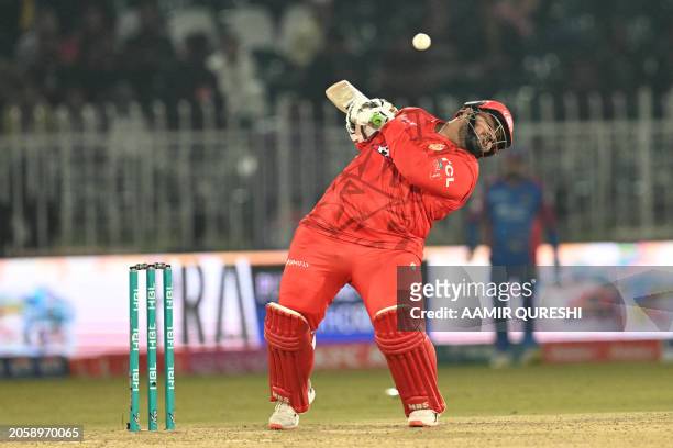 Islamabad United's Azam Khan avoids a bouncer during the Pakistan Super League Twenty20 cricket match between Karachi Kings and Islamabad United at...