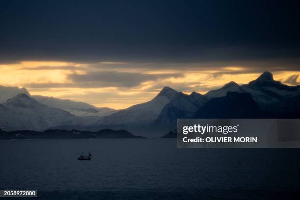 Fishermen boats sail out of Svolvaer harbour in Lofoten Islands, on March 2, 2024.