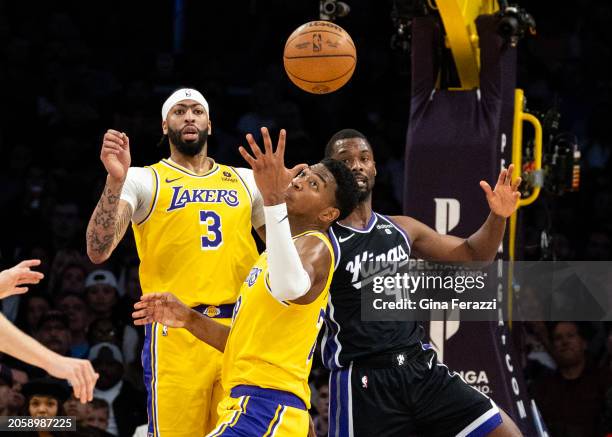 Los Angeles Lakers forward Rui Hachimura reaches out for a defensive rebound agains tSacramento Kings forward Harrison Barnes and teammate Los...