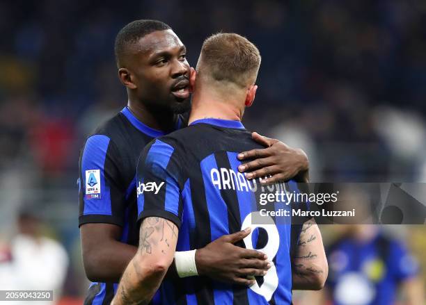 Marcus Thuram and Marko Arnautovic of FC Internazionale embrace following the Serie A TIM match between FC Internazionale and Genoa CFC - Serie A TIM...