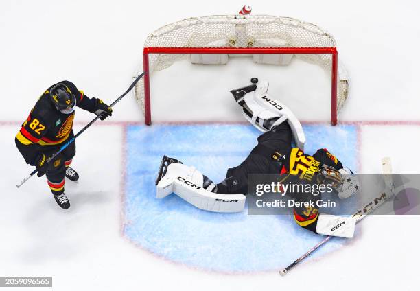 Thatcher Demko and Ian Cole of the Vancouver Canucks look on after a Los Angeles Kings goal during the third period of the NHL game at Rogers Arena...