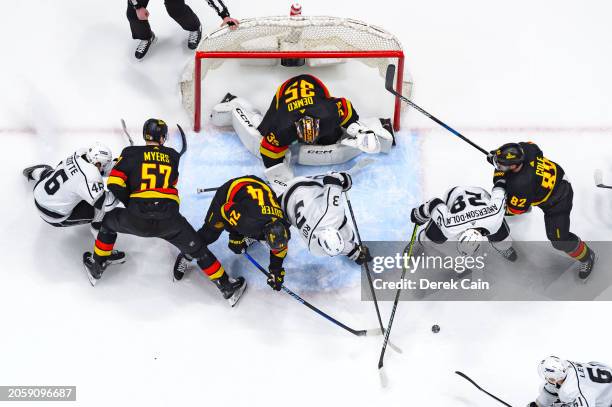 Thatcher Demko Pius Suter Tyler Myers and Ian Cole of the Vancouver Canucks defend against Blake Lizotte Matt Roy and Jaret Anderson-Dolan of the Los...