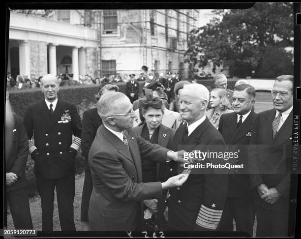President Harry S Truman pins a gold star on Admiral Chester W Nimitz during a ceremony on the White House lawn, Washington DC, October 5, 1945....