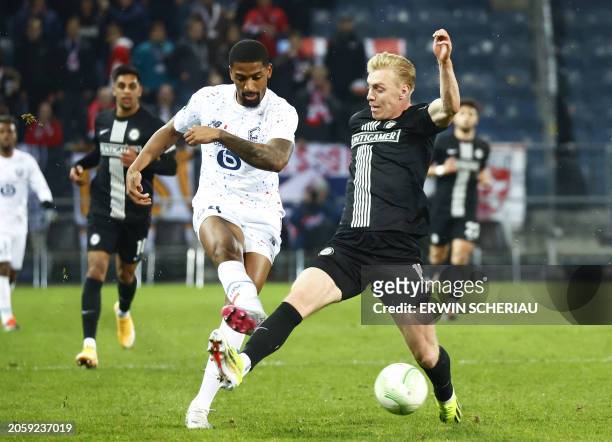 Lille's Brazilian defender Alexsandro and Sturm Graz's English forward Mika Biereth vies for the ball during the UEFA Conference League round of 16...