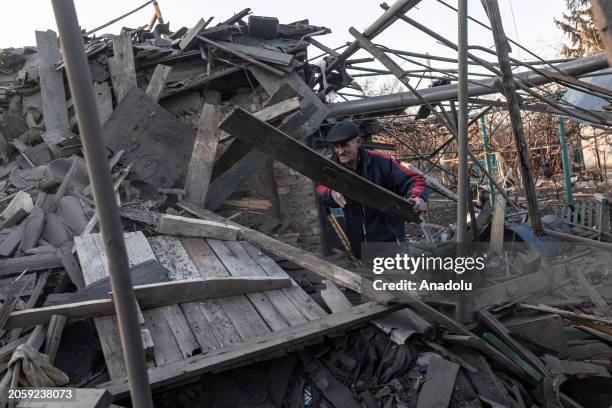 Resident clears debris from his house , destoyed due to Russian shelling as Russia-Ukraine war continues in Kostiantynivka, Ukraine on March 07, 2024.