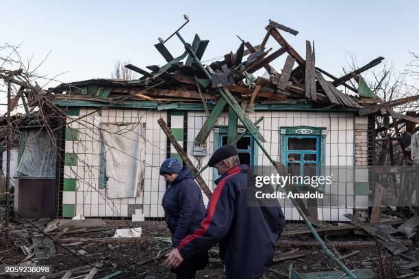 Couple are seen in front of their house, destroyed due to Russian shelling as Russia-Ukraine war continues in Kostiantynivka, Ukraine on March 07,...