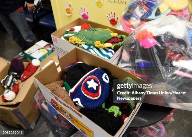 Year-old Dillon Speanburgh of Valley Falls and Jeremy Wernick of Latham deliver 900 hats for patients at Albany Medical Center on Tuesday, Dec. 10,...