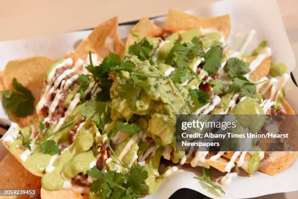 Nachos - chorizo, queso blanco, salsa verde, guacamole, crema at The Daisy on Thursday, Dec. 12, 2019 in Troy, N.Y.