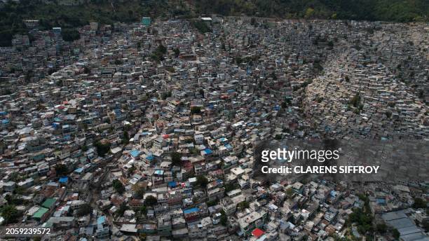 Graphic content / An aerial view of Port-au-Prince, Haiti, March 7, 2024. Haiti's troubled capital was put under a state of emergency for another...