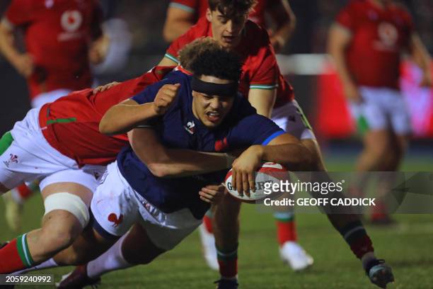 France U20's prop Zinedine Aouad dives over the line to score his second try during the U20 Six Nations international rugby union match between Wales...