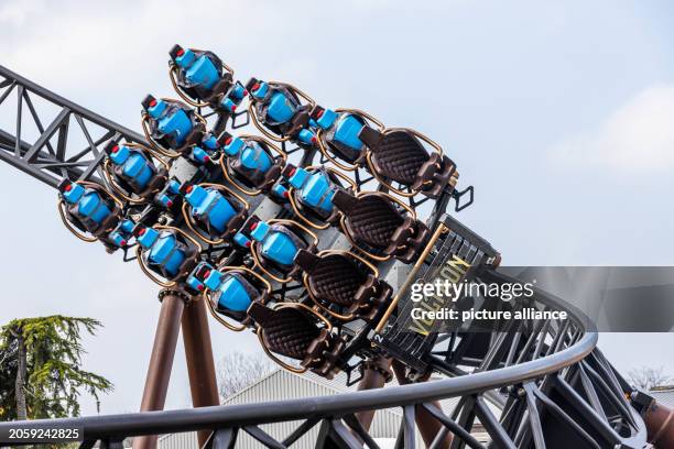 March 2024, Baden-Württemberg, Rust: A train of the "Voltron Nevera" roller coaster runs along the tracks loaded with water dummies. The new roller...