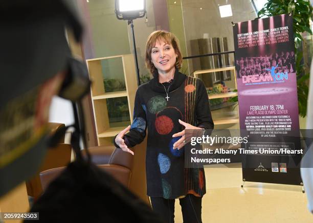 Olympic Skater Caitlin "Kitty" Carruthers Conrad talks to the press after flying into Albany International Airport on her way to Lake Placid as the...