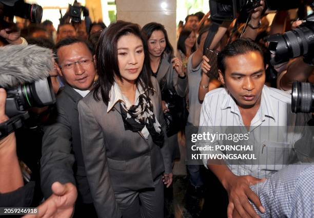 Yingluck Shinawatra , who is set to become the kingdom's first female prime minister arrives prior to meeting with possible coalition partners at...