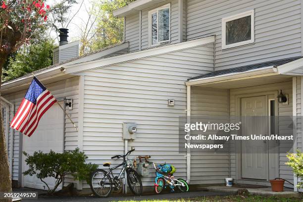 Bicycles are seen outside a townhouse where a woman and state trooper were seen leaving during an investigation at Tallow Wood Drive where Gustavo...