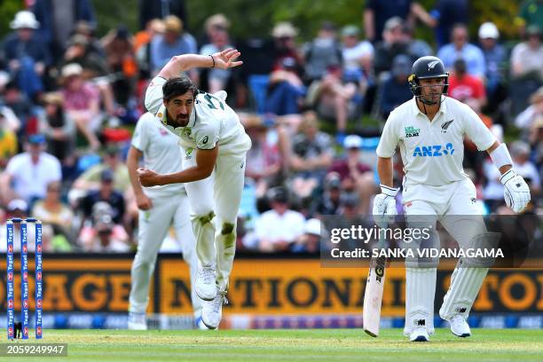 Australia's Mitchell Starc bowls past New Zealand's Will Young on day one of the second Test cricket match between New Zealand and Australia at...