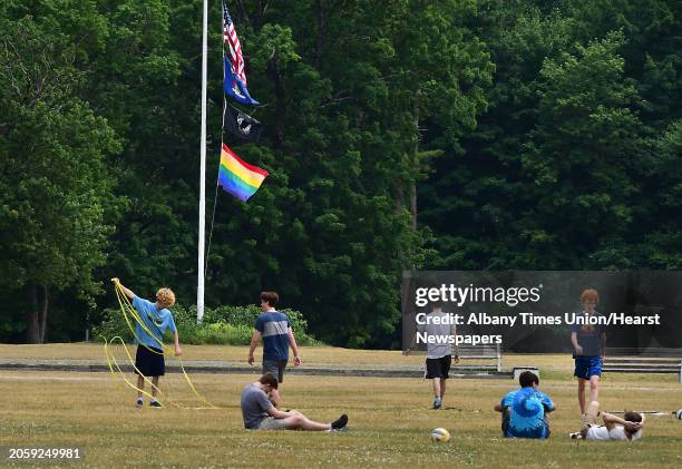 Teenagers take down a net after playing volleyball at the Saratoga Spa State Park on Tuesday, June 23, 2020 in Saratoga Springs, N.Y.