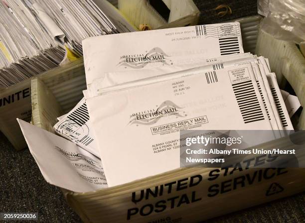 Absentee ballots are seen in bins as ballot counting begins in the Albany County District Attorney's race between David Soares and Matthew Toporowski...