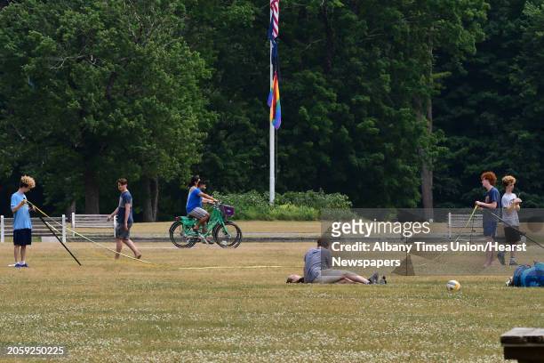 Teenagers take down a net after playing volleyball at the Saratoga Spa State Park on Tuesday, June 23, 2020 in Saratoga Springs, N.Y.