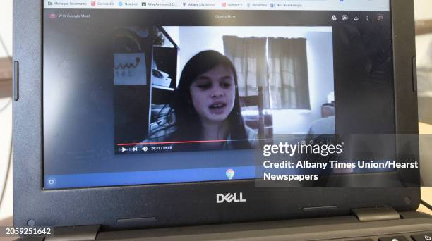 Third grade student is seen on teacher Kathleen Axtmann's computer as she teaches her students remotely from her classroom at New Scotland Elementary...