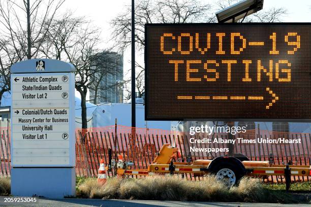 Sign directs traffic for the drive-through COVID-19 testing site at University at Albany on Thursday, Dec. 3, 2020 in Albany, N.Y.