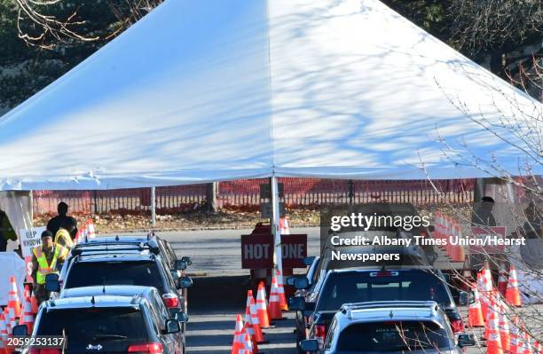 Cars are seen lined up at the drive-through COVID-19 testing site at University at Albany on Thursday, Dec. 3, 2020 in Albany, N.Y.