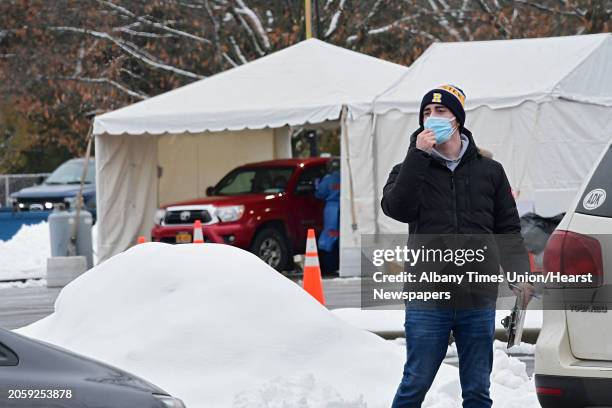 Health care worker asks drivers to move up at a state testing site set up in Saratoga Spa State Park to provide COVID-19 testing for N. Fox jewelry...