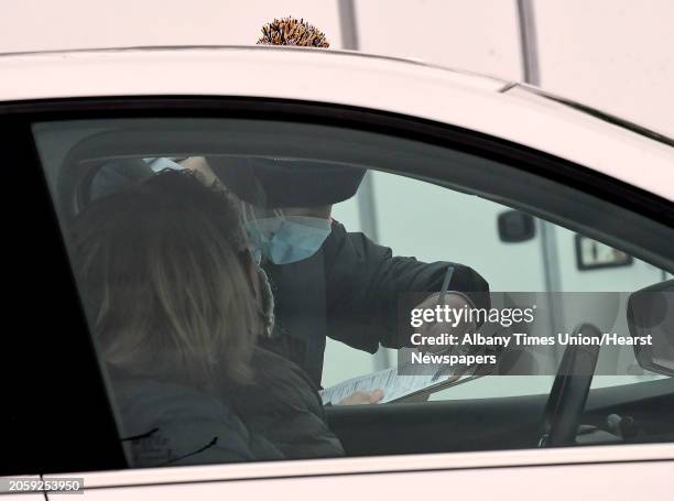 Health care worker obtains information from a driver at a state testing site set up in Saratoga Spa State Park to provide COVID-19 testing for N. Fox...